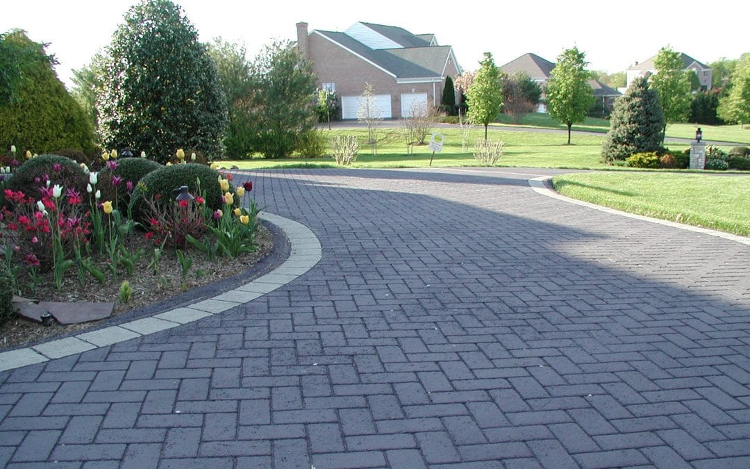 Brick patterned driveway installed for home